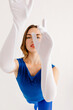 © Tania Cervian/Stocksy - Charming ballerina in blue dancing outfit  in studio