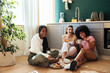 © BONNINSTUDIO/Stocksy - Female roommates having breakfast in kitchen
