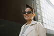 © Azamat Mukanov/Stocksy - Smiling Asian Woman in Sunglasses