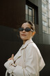 © Azamat Mukanov/Stocksy - Smiling Asian Woman in Sunglasses