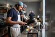 © Hernandez & Sorokina/Stocksy - Work At Indian Restaurant Kitchen