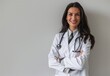 © Cetin - Portrait of beautiful smiling female doctor standing with arms crossed