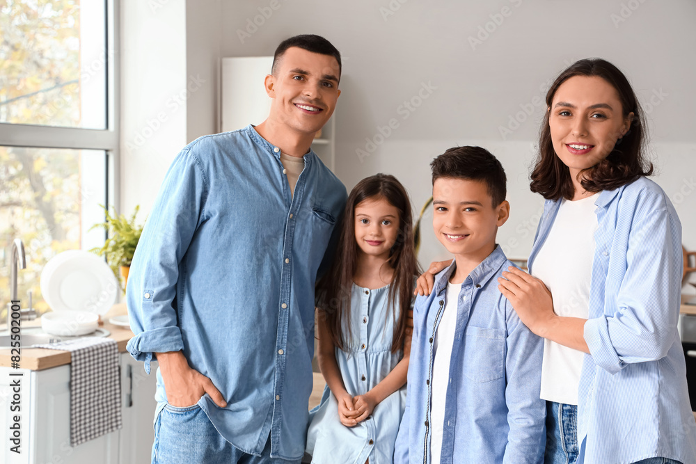 Little children with their parents in kitchen