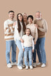 © Pixel-Shot - Happy big family on beige background