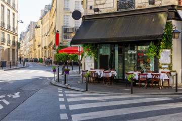 Wall Mural - cozy street with tables of cafe in paris, france. cityscape of paris. architecture and landmarks of 