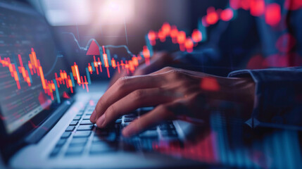 Poster - Close-up of hands typing with stock market inflation charts in the background