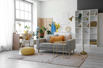 Wall Mural - Interior of living room with sofa, workplace and surfboard