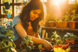 © VisualProduction - Hispanic woman potting plants in her garden shed with sunset light filtering in.