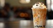 © Elena - vanilla caramel milk boba bubble tea drink in a cup on a table banner with copy space