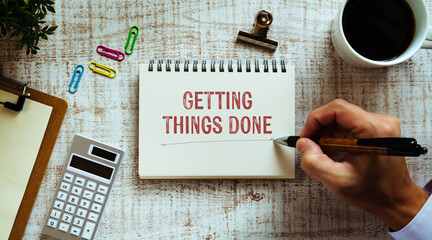 There is notebook with the word Getting Things Done. It is as an eye-catching image.