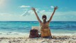 © Sina - A woman sits on the beach with her arms raised in celebration, working remotely with her laptop. Perfect for themes of freedom, remote work, and summer vacations.