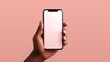 © M.IVA - Hand Holding Smartphone mockup with Blank white Screen Against Pink Background.