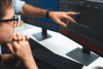 it developers creating online software development information on screen laptop with coding program 