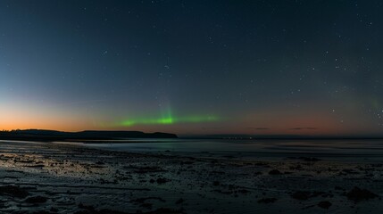 Wall Mural - A brilliant flash of green on the horizon marks the transition from day to night.