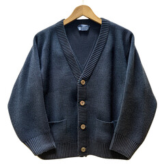 Wall Mural - Front view of a navy blue cardigan on a wooden hanger isolated on a white transparent background