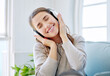 © peopleimages.com - Woman, headphones and happy music in home, relax and subscription for streaming playlist on couch. Female person, podcast and online for audio or sound on weekend, entertainment and listening to song
