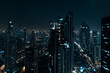 © song - City Skyline at Night: Aerial View of Illuminated Skyscrapers