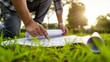 © Generative ART - Architect Reviewing Blueprints Outdoors in a Green Park