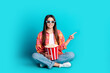 © deagreez - Full size photo of nice young girl point finger empty space 3d glasses movie popcorn isolated on teal color background