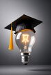 © R_Creations - Graduation cap on a glowing light bulb, symbolizing the fusion of education and innovation for bright futures
