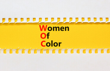 Wall Mural - WOC women of color symbol. Concept words WOC women of color on beautiful yellow paper. Beautiful white paper background. Business WOC women of color social issues concept. Copy space.