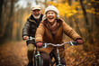 © Tasfia Ahmed - older couple riding bikes in the woods in the fall