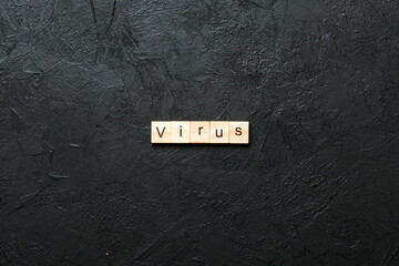 Wall Mural - virus word written on wood block. virus text on cement table for your desing, concept