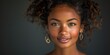 © Interior Stock Photo - Portrait of a smiling woman with curly hair exuding elegance and confidence on a dark background