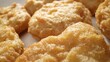 © Punyawee - A chicken nugget is a small piece of chicken, coated in batter or breadcrumbs, and deep-fried or baked, often served as a fast-food snack. Shot with 24mm probe macro lens. Food background.