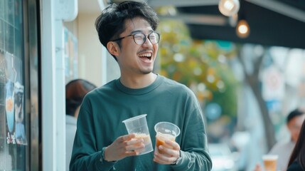 Sticker - A man is smiling and holding two plastic cups