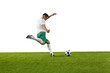 © Lustre Art Group  - Side view of young fit man, soccer player ready to kick a soccer ball on green grass field against white background. Concept of professionals sport, competition, tournament, energy, action. Ad
