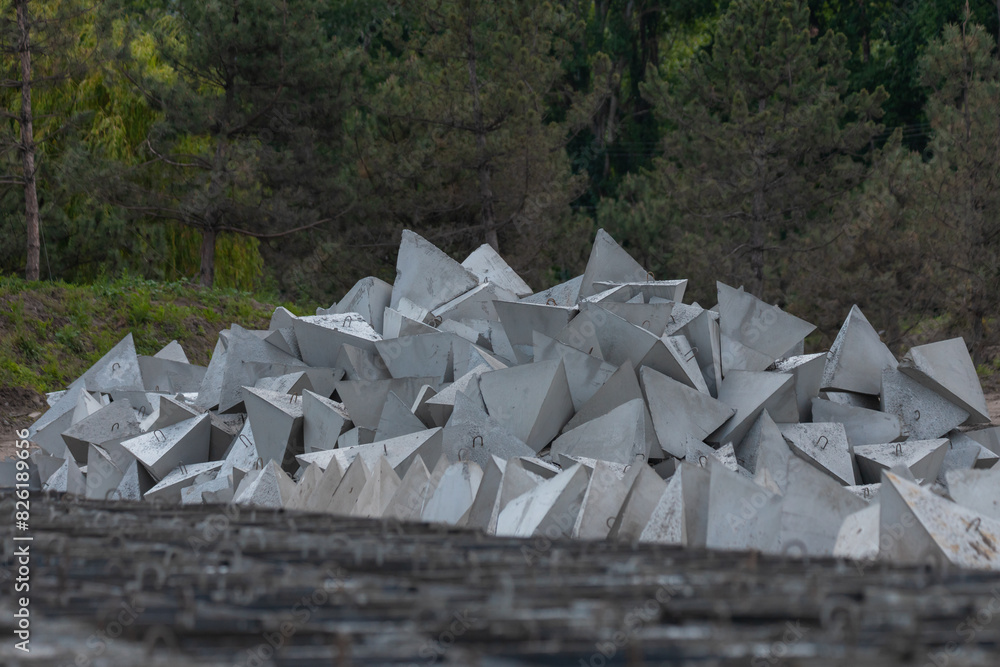 Making dragon teeth for defense. Concrete pyramids. Protection and trap ...