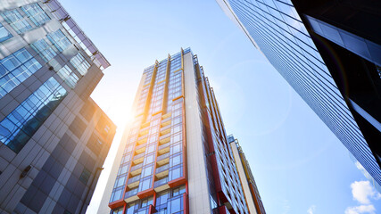 Wall Mural - Exterior of a high modern multi-story apartment building - facade, windows and balconies.