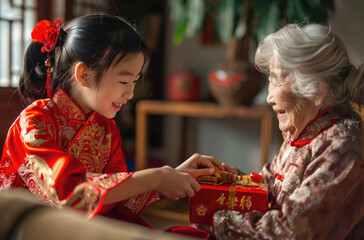 Canvas Print - A Chinese girl in red traditional dress is giving her grandmother a gift box, with the New Year atmosphere of China in the background