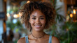 © Lucia - portrait of a black woman with garden background smiling at camera