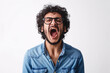 © SITI - Angry Middle Eastern Man with Curly Hair and Glasses Yelling in Denim Shirt, Expressing Frustration Indoors