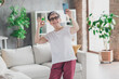 © deagreez - Photo of nice senior woman video call okey dressed white clothes cozy living room home house flat indoors pension concept