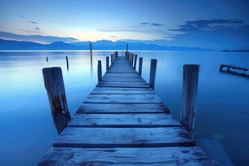 Wall Mural - Blue Lake. Wooden Pier on a Sunset Horizon with Sky Reflection