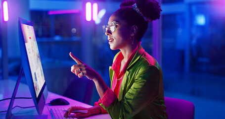 Poster - Black woman, business and neon light in office and working on laptop to search or online for fashion idea. Female person, gen z and creative with pencil for designing or drawing and happy with result
