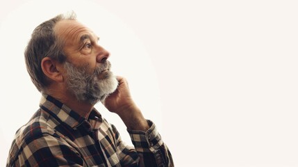 Canvas Print - A man with a beard wearing a plaid shirt. Perfect for lifestyle or fashion concepts