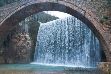 Wall Mural - marvelous medieval stone bridge with two river waterfalls, Trikala, Elati, Paleokarya Waterfalls