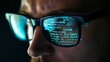 © Nene - Closeup of a Male IT Professional's Face with Glasses Reflecting Computer Code in a Dark Room for a High-Tech and Intense Atmosphere