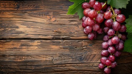 Wall Mural - Bunch of red grapes on rustic wooden background