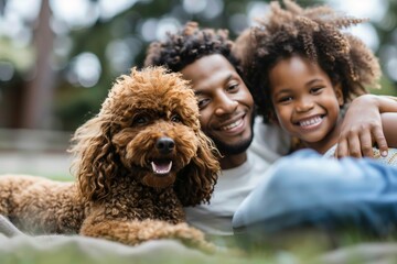 a joyful father and daughter posing playfully with a delightful brown dog on the grass, looking at t