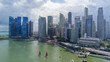 © AmazingAerialAgency - Singapore, Singapore - 20 May 2024: Aerial view of modern economic district with sky scrapers and Marina Bay, Singapore.