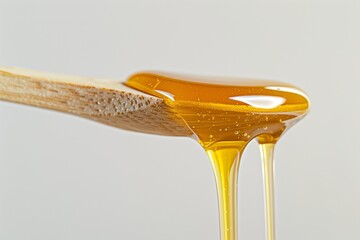 Wall Mural - a spoon with honey on top of it, overflowing