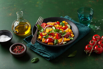 Wall Mural - healthy vegetarian tomato sweet corn salad with cucumber and basil
