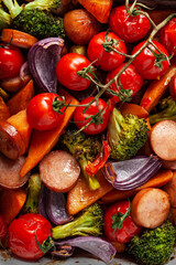 Wall Mural - oven baked vegetables and sausages, healthy lunch, sweet potato onion tomato broccoli