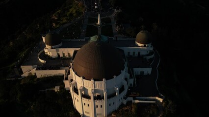 drone shot showing the park in front of griffith observatory.