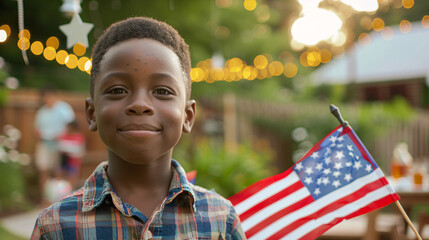 young black boy holding usa flag 4th of july independence day celebration garden party memorial day 